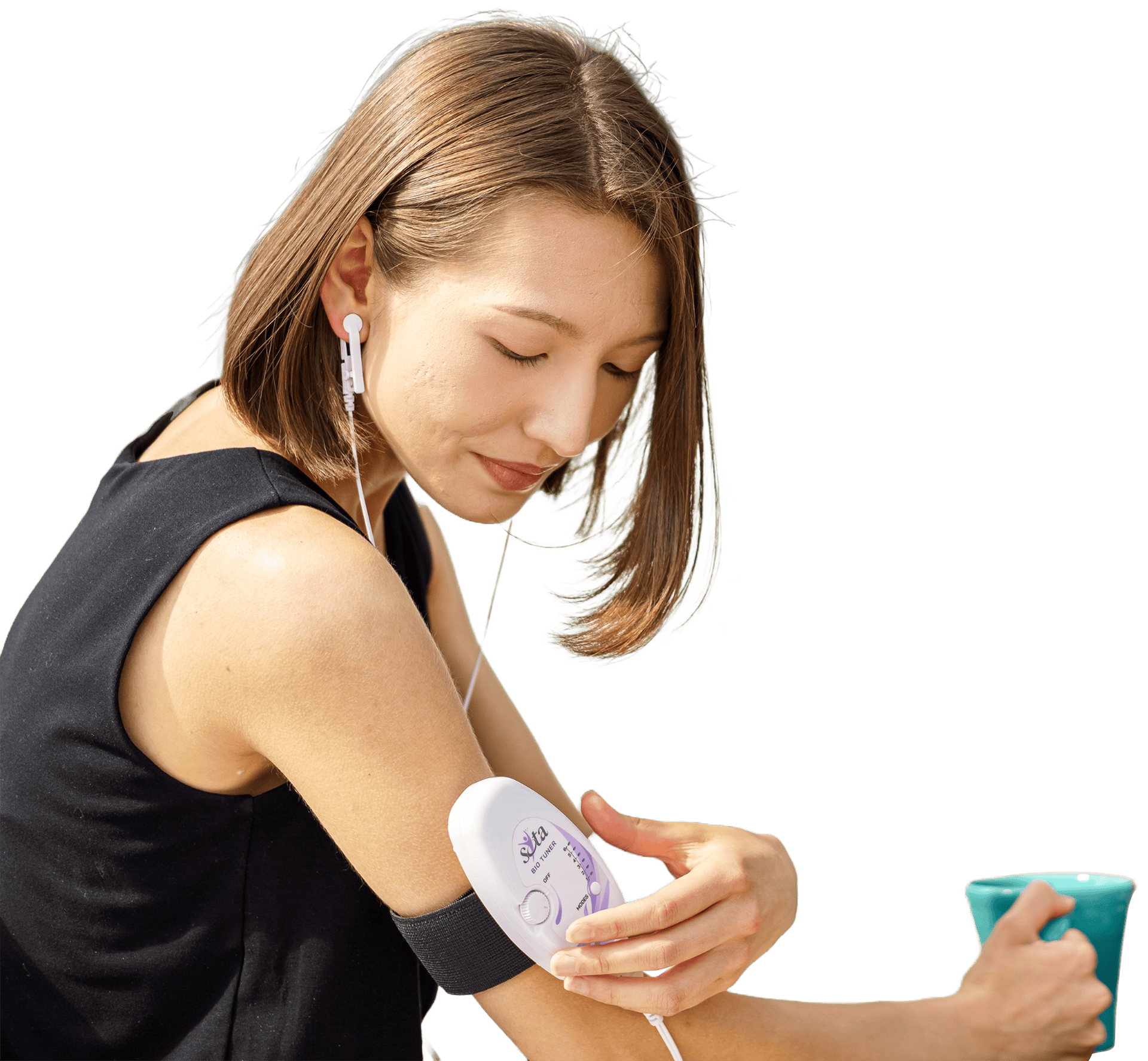 A person relaxing at home while wearing the Bio Tuner Ear Clips