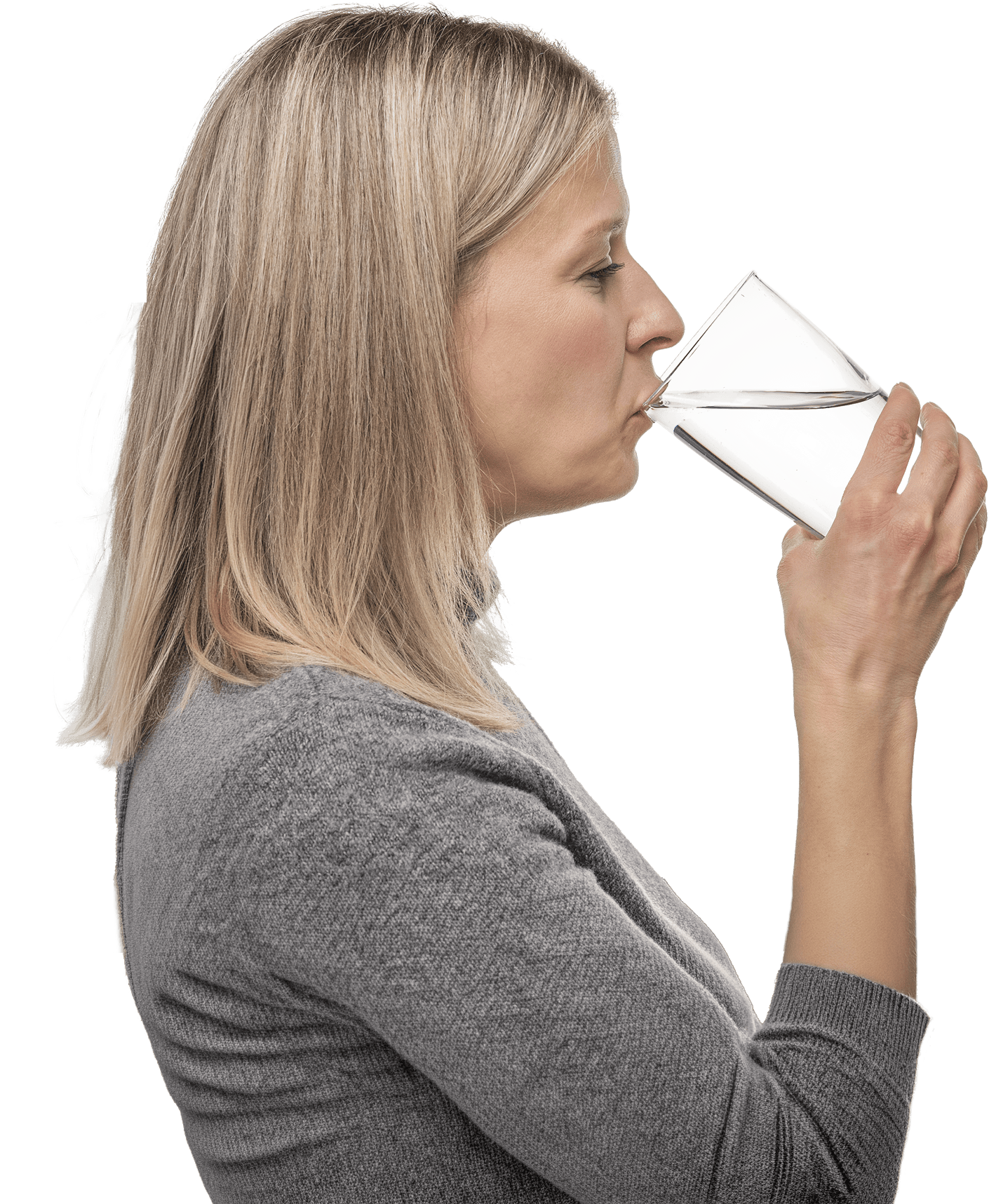 Woman drinking a glass of ozonated water