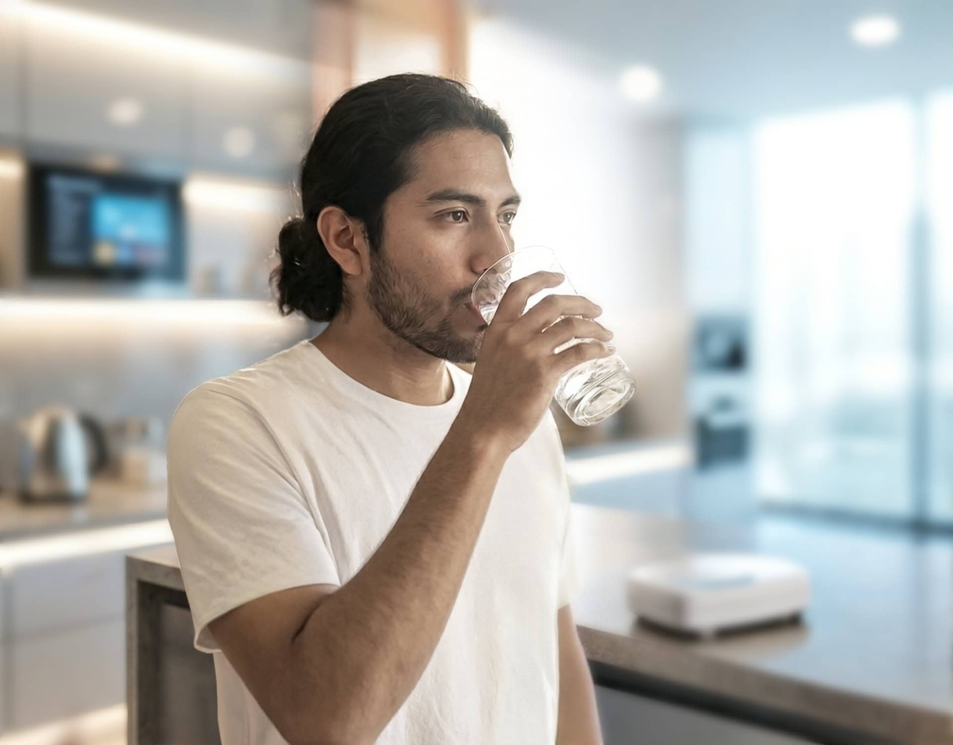 Person lifting the airstone out of a glass and preparing to drink